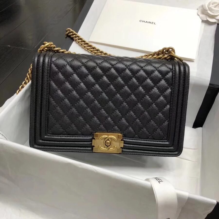 Chanel Boy , black caviar with gold hardware